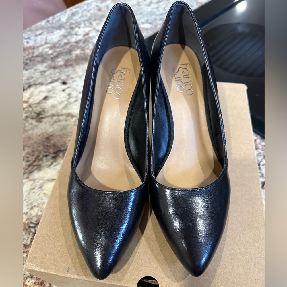 Black wedge pumps - barely worn. One small nick on the heel, shown in pic.